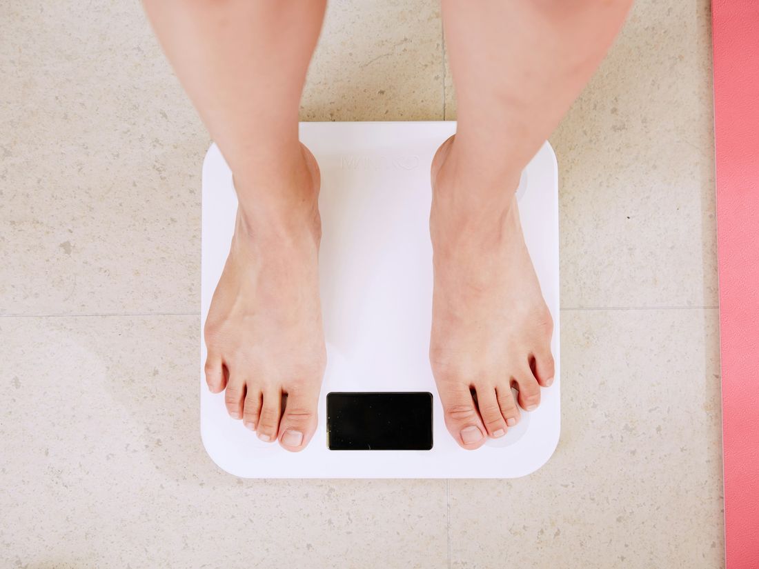 Person standing on a scale – medical weight loss